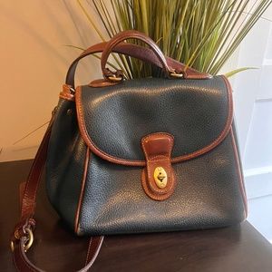 Navy and brown Coach handbag
